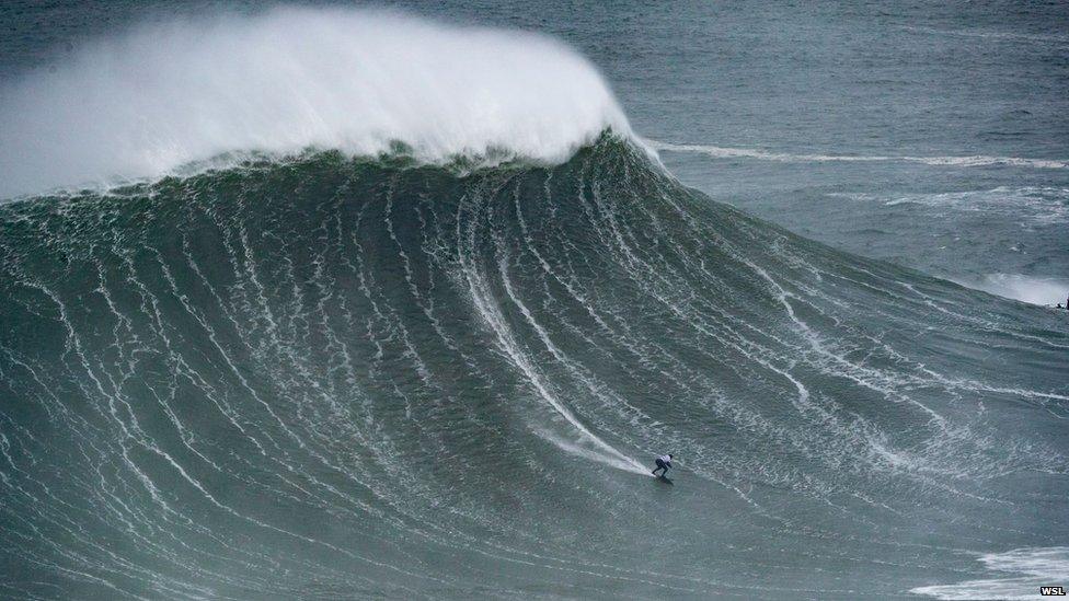 Maya Gabeira surfing a massive wave at Nazare in 2018