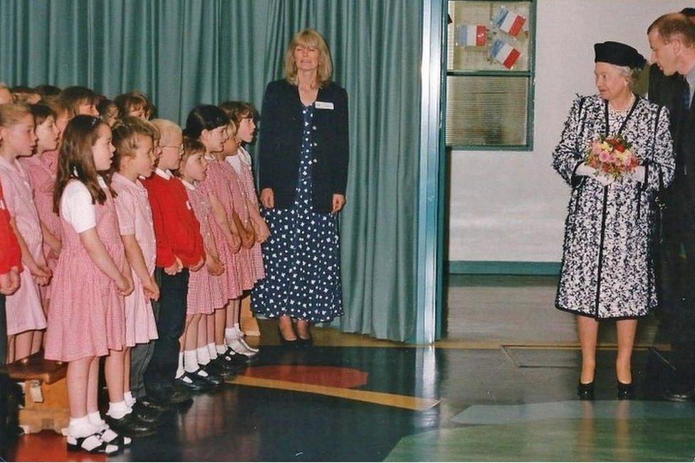 Queen Elizabeth II meeting pupils at Prudhoe High School, May 1998, with the Prudhoe West School Years 3 and 4 choir singing and accompanied by their teacher Anne Walker