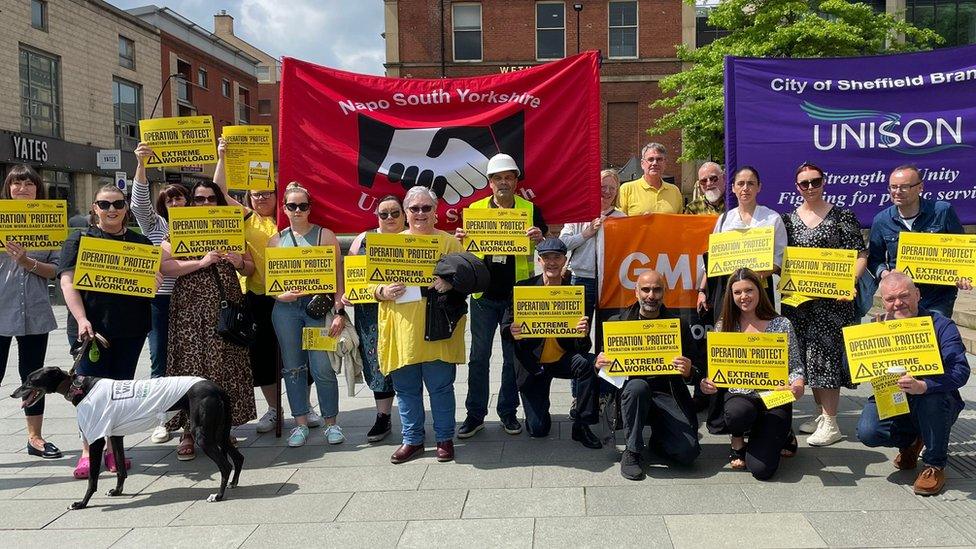 People attend a rally in Sheffield city centre