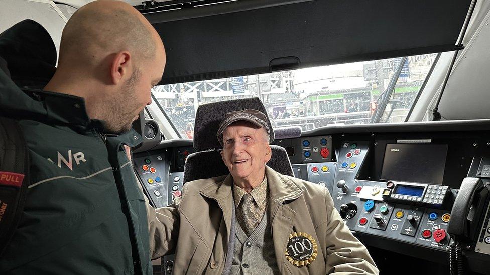 Alf Wells with the driver in the cab of an Intercity train