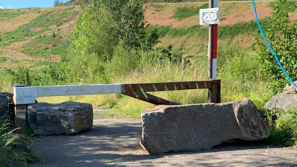 Boulders blocking the road