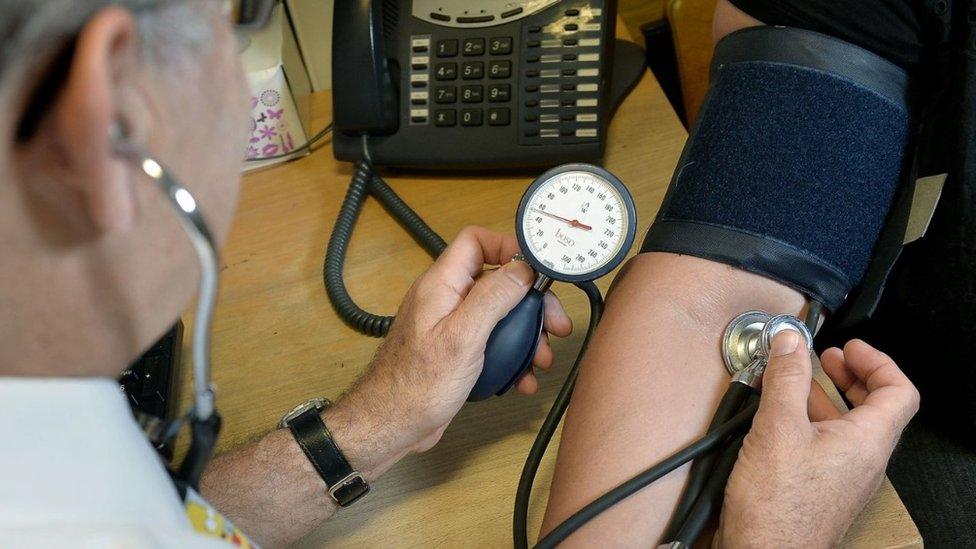 A stock image of blood pressure being taken