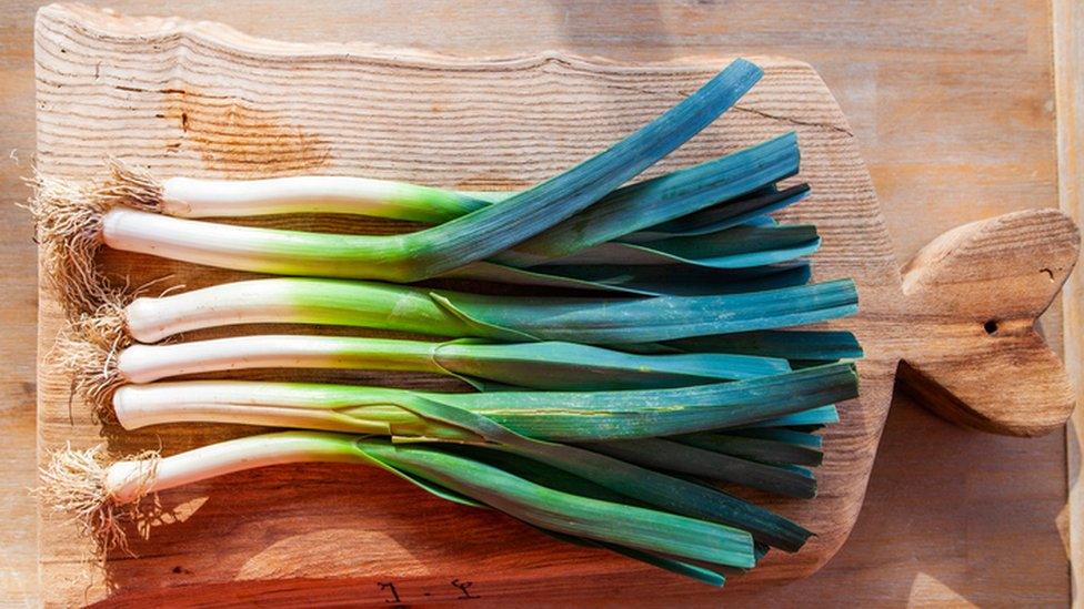 leeks on a chopping board