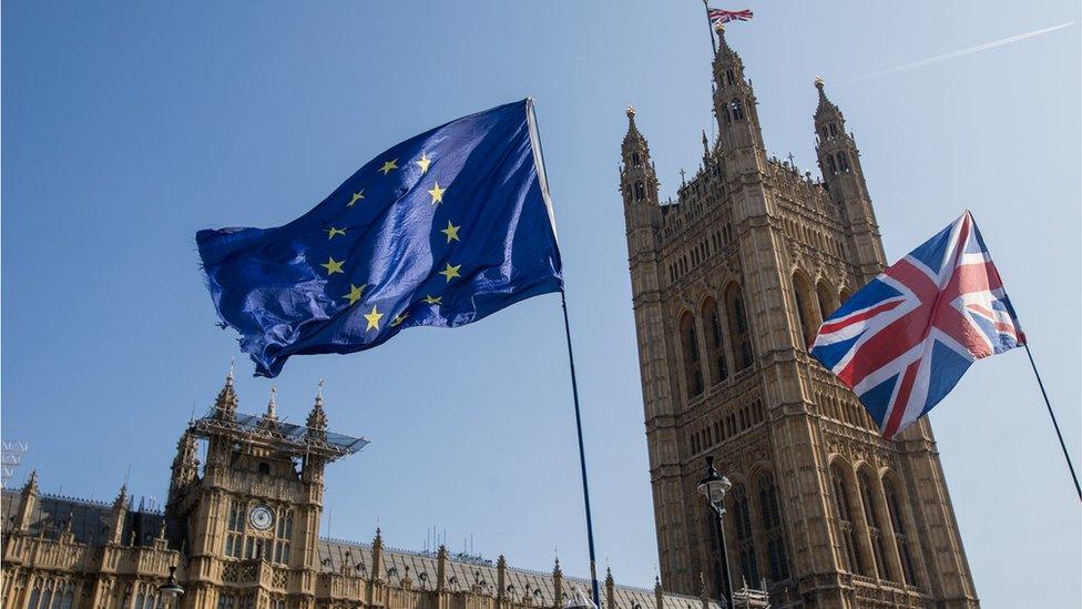 A European Union (EU) flies alongside a British Union flag, also known as a Union Jack in London