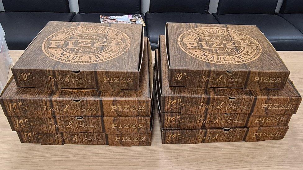 The pizza boxes