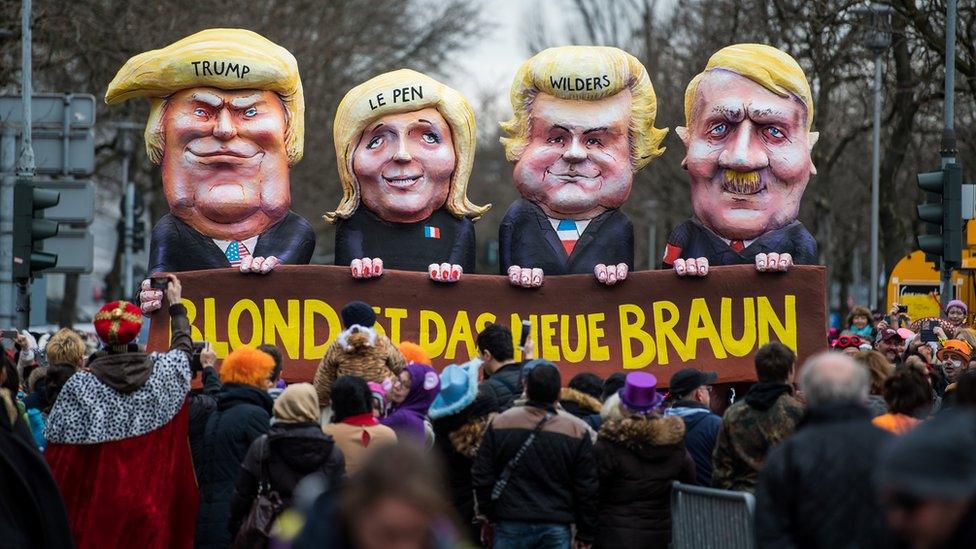 President Donald Trump (L-R), Marine Le Pen of Front National, Geert Wilders of Partij voor de Vrijheid and Adolf Hitler drives in the annual Rose Monday parade on February 27, 2017 in Dusseldorf, Germany.