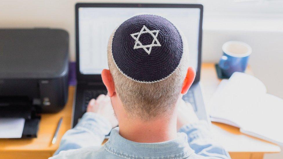 Jewish man using a laptop