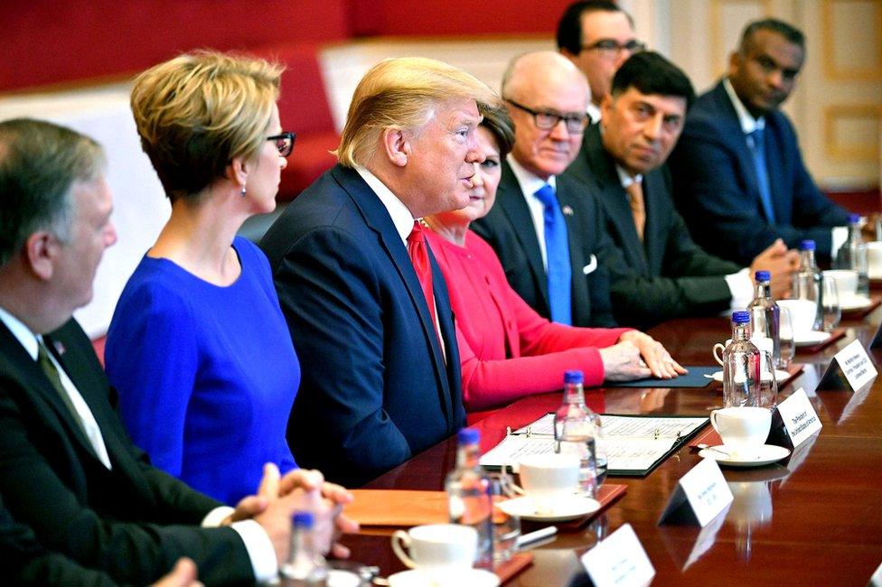 Mr Trump and others at a table in St James's Palace