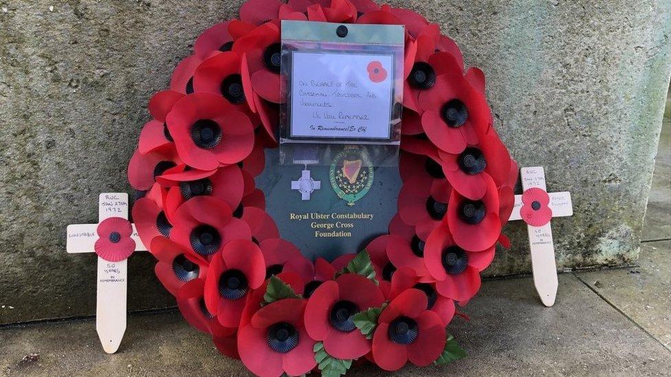 a wreath at the cenotaph in Londonderry to remember RUC officers killed in the troubles