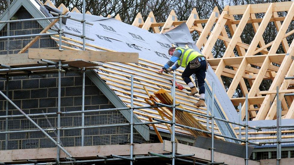 Builder working on a roof