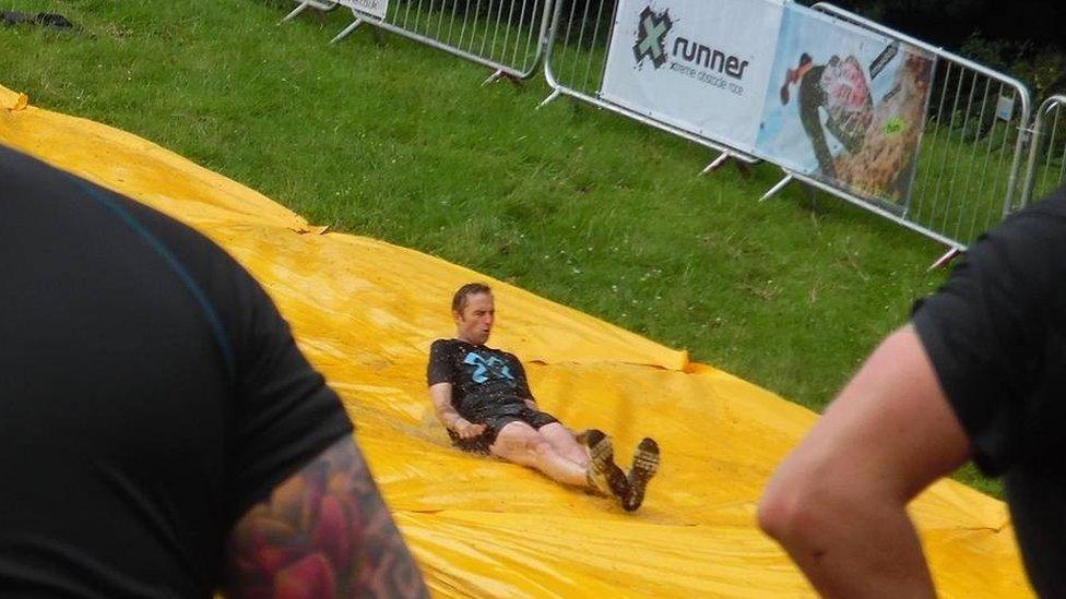 Man goes down waterslide