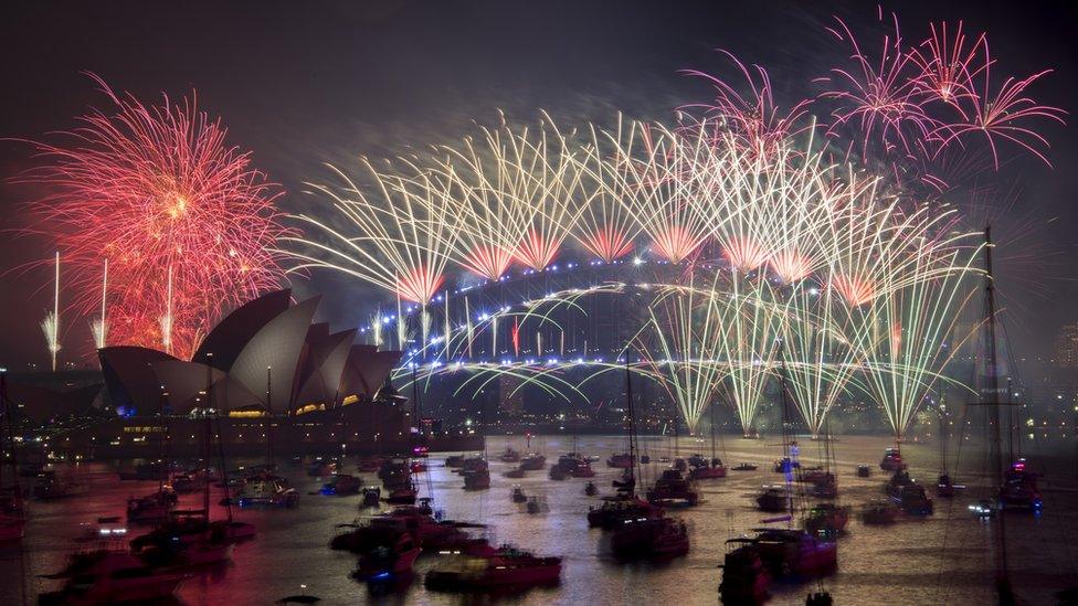 Fireworks explode over the harbour and the Sydney Harbour Bridge landmark during New Year's celebrations in Sydney, Australia, 1 January 2019