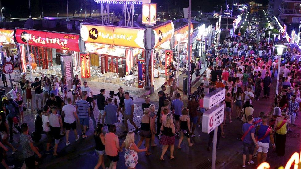 Tourists walk at Punta Ballena street in Magaluf, on the Spanish Balearic island of Majorca, 13 June, 2015.