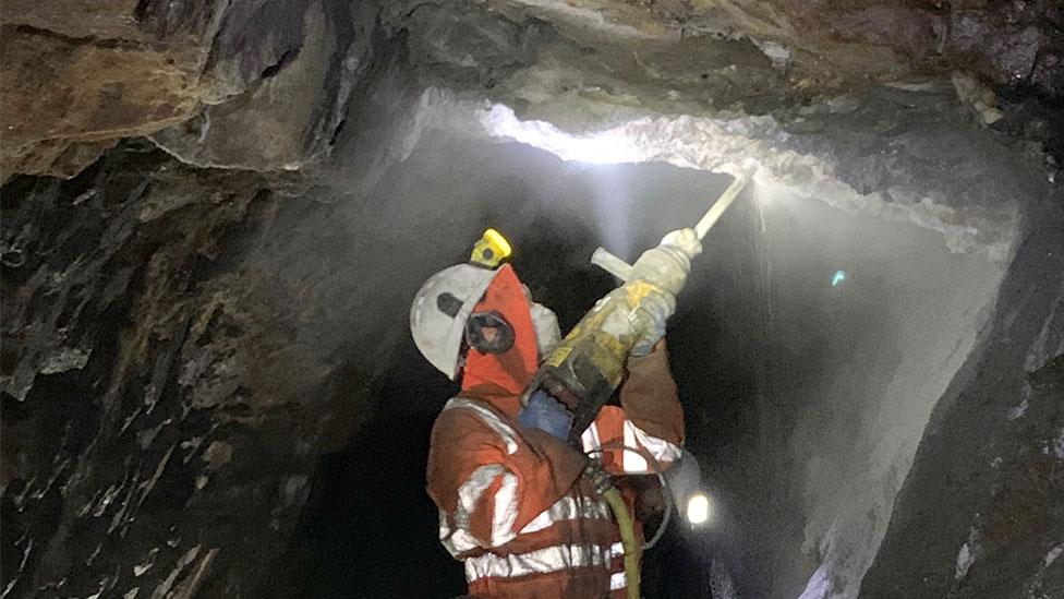 A man drilling underground