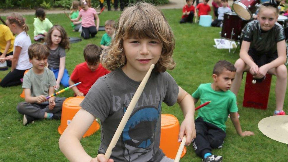 Merrick Surman and local children drumming at the National Trust's Quarry Bank Mill