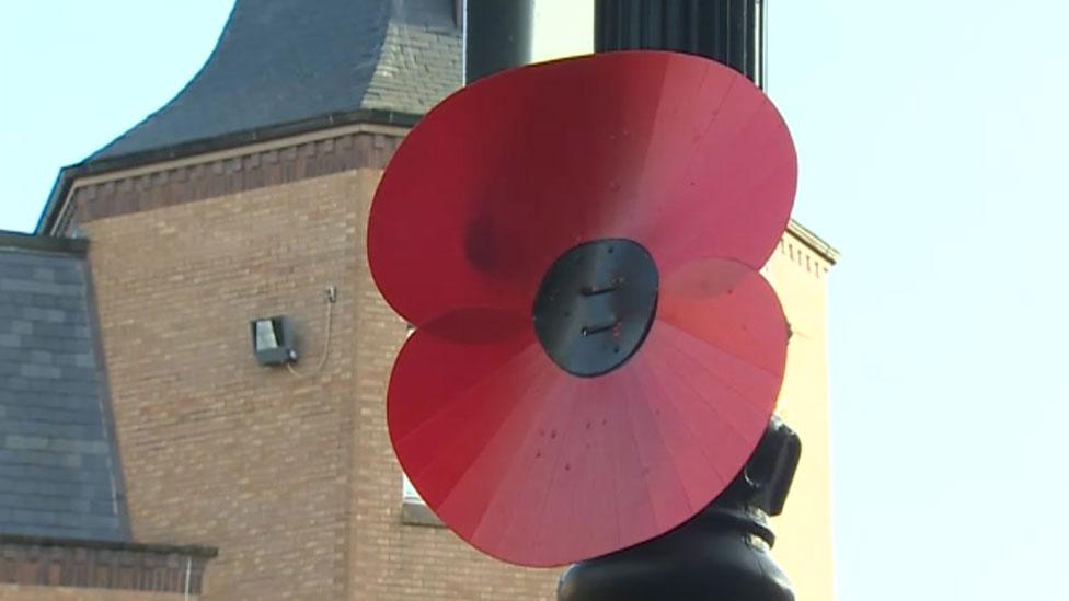 Large poppy on lamppost