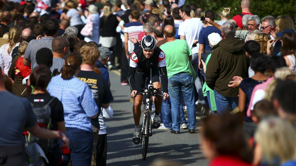 An athlete competes in the bike section during Ironman Wales 2015