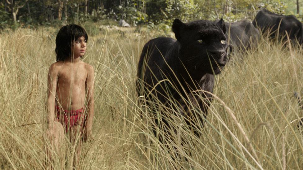 Neel Sethi with 'Bagheera' in The Jungle Book