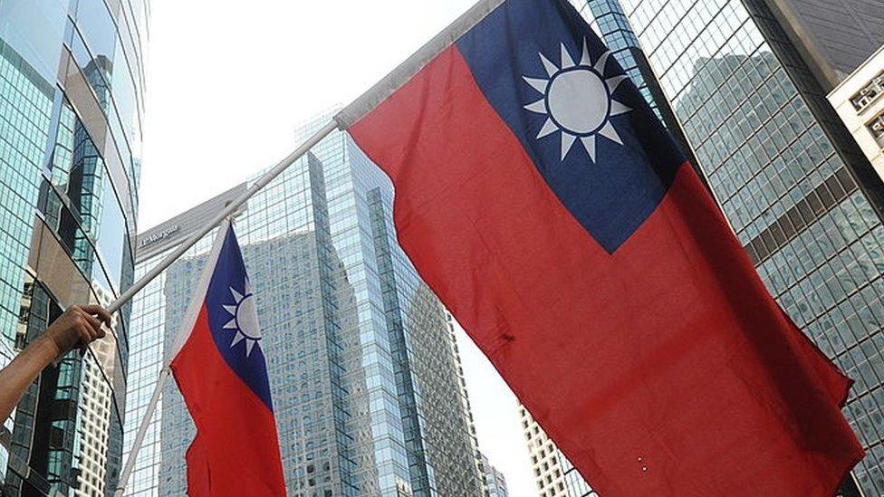 Protestors wave Taiwanese flags in Hong Kong on 17 September 2010.