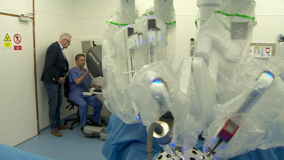 The robotic limbs are controlled remotely by the consultant surgeon