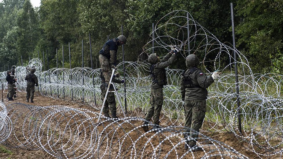 Polish soldiers are seen building a fence along the border with Belarus - 26 August 2021