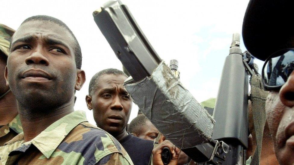 Guy Philippe (left) during march in the city of Gonaives, Feb 2004