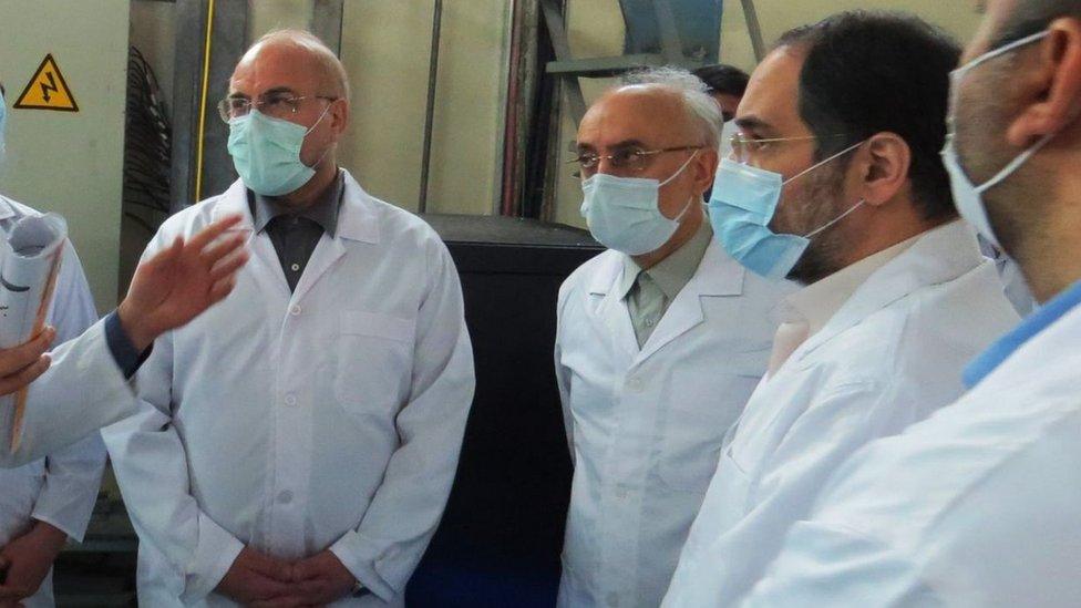 A handout photo made available by the Atomic Energy Organisation of Iran shows Iranian Parliamentary speaker Mohammad Baqer Qalibaf (L) and head of Atomic Energy Organisation of Iran Ali Akbar Salehi (2nd L) visiting the Fordo enrichment facility in Iran (28 January 2021)