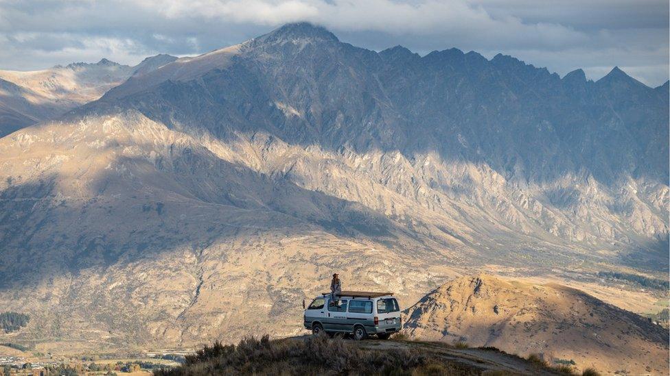 Campervan overlooking mountains.