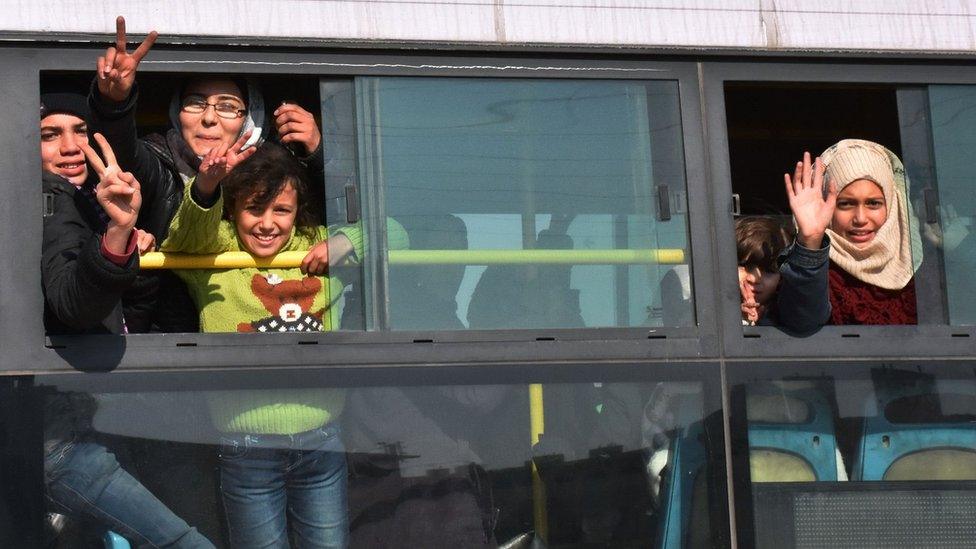 Syrians who were evacuated from Foah and Kefraya celebrate after reaching government-controlled Aleppo (19 December 2016)