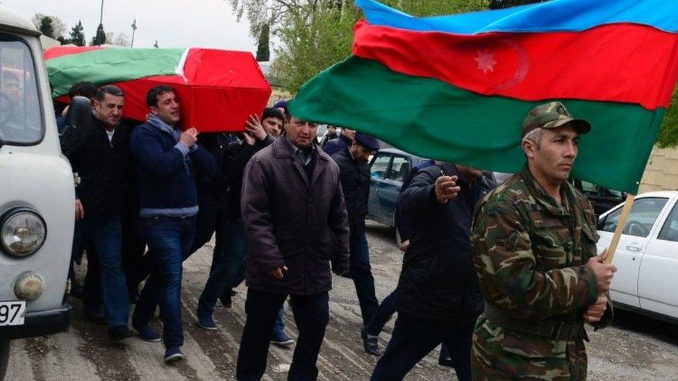 Men carry the coffin of an Azerbaijani serviceman killed in clashes in Nagorno-Karabakh on 2 April 2016