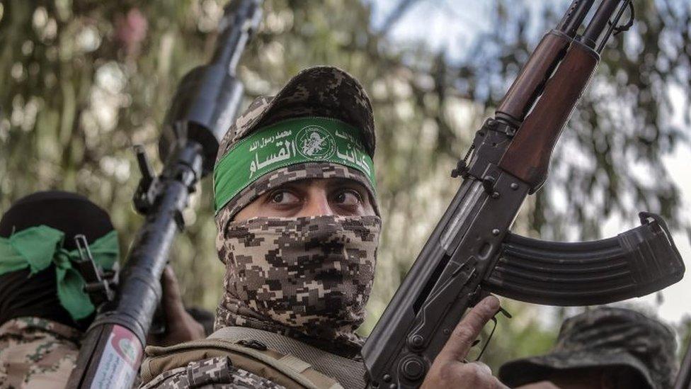 Fighters in Hamas's military wing march in Gaza City on Saturday