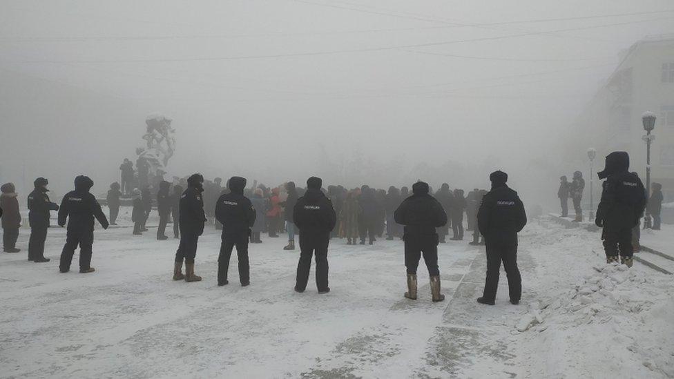 Law enforcement officers stand guard during a rally in support of jailed Russian opposition leader Alexei Navalny in Yakutsk