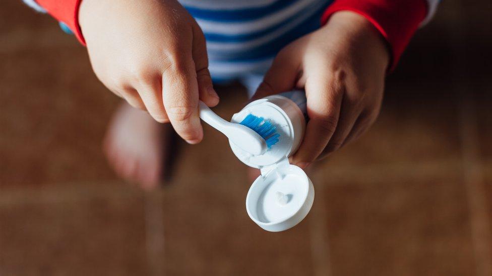 Stock image of a child with a toothbrush