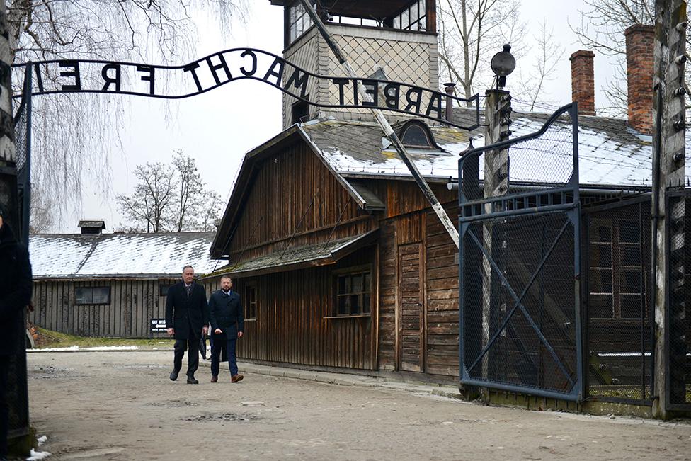 Second Gentleman of the United States Douglas Emhoff walks through the camp's main gate at the Memorial and Museum Auschwitz-Birkenau in Oswiecim, Poland on 27 January 2023