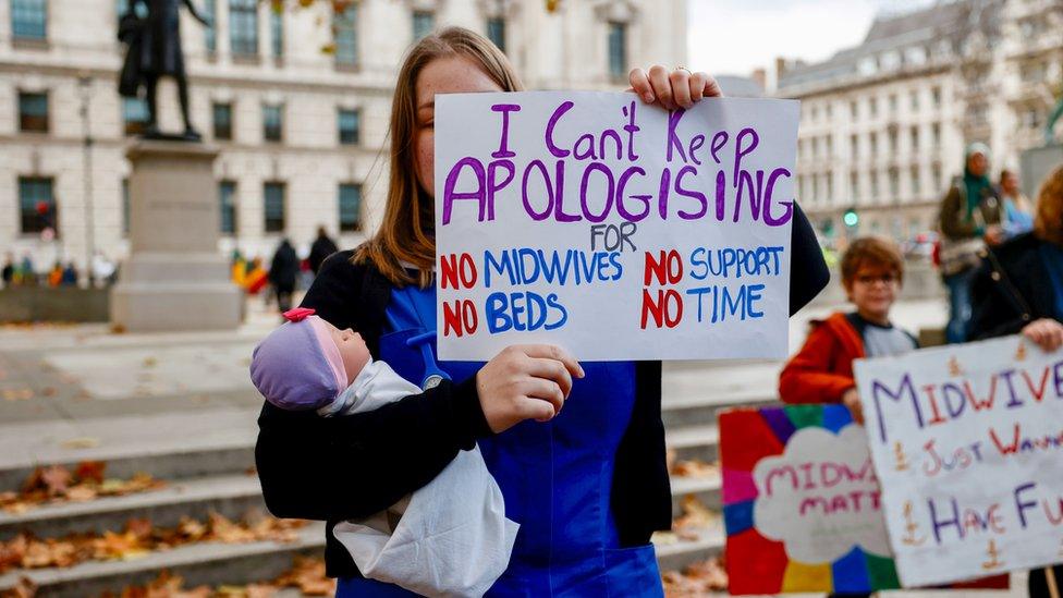 Photograph of a midwife protesting