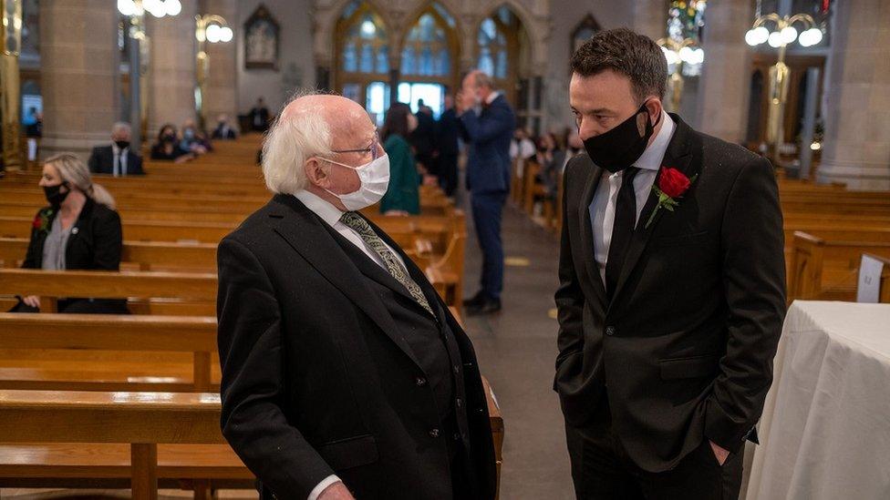 Michael D Higgins and Colum Eastwood at the funeral of John Hume