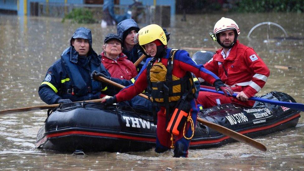 Staff of the Bavarian Red Cross and the German Federal Agency for Technical Relief (THW) evacuate people in Simbach, Germany, 1 June 2016.