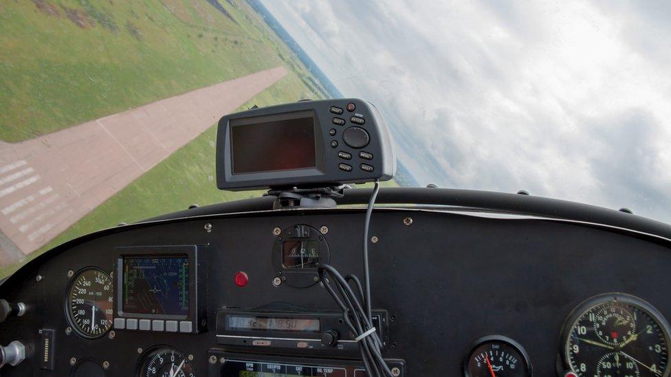 Light aircraft cockpit coming into land