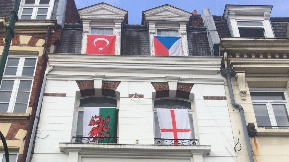 Flags being flown from windows