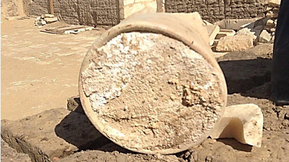 A broken jar containing a 3,200-year-old piece on cheese