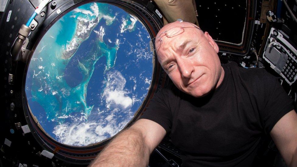 Handout photograph of Nasa astronaut Scott Kelly overlooking earth from space