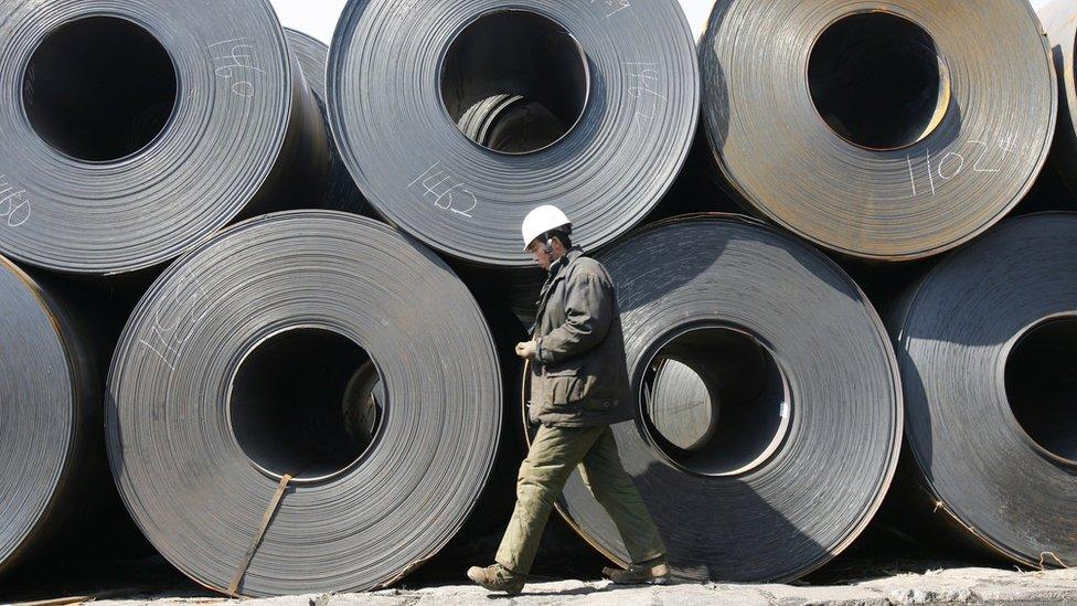 A worker at a steel wholesale market in Liaoning Province, China