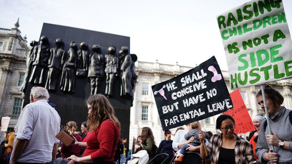 Demonstrators take part in a march in central London demanding reform of childcare, parental leave and flexible working