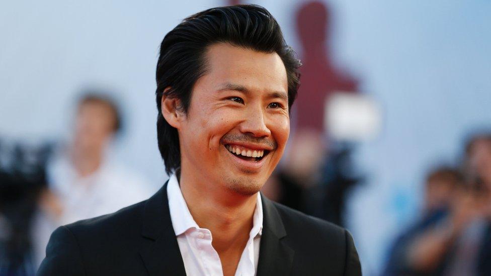 French actor Frederic Chau poses on the red carpet on September 9, 2016 in the northwestern sea resort of Deauville, as part of the 42nd Deauville US Film Festival