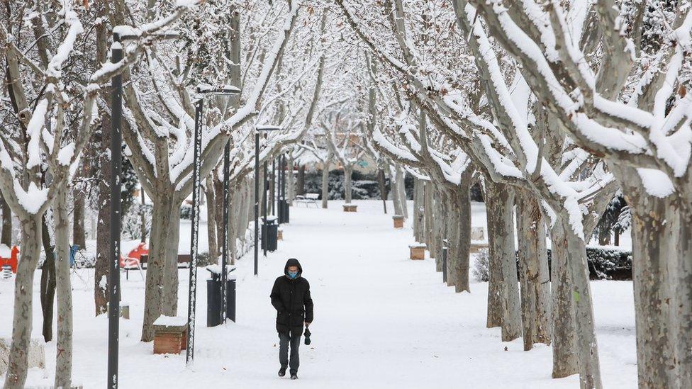 man-walks-in-snow