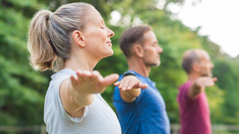 Group of people doing yoga