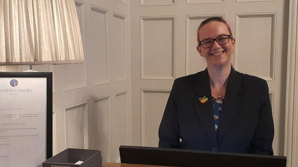 Julie Simmons at her hotel reception desk