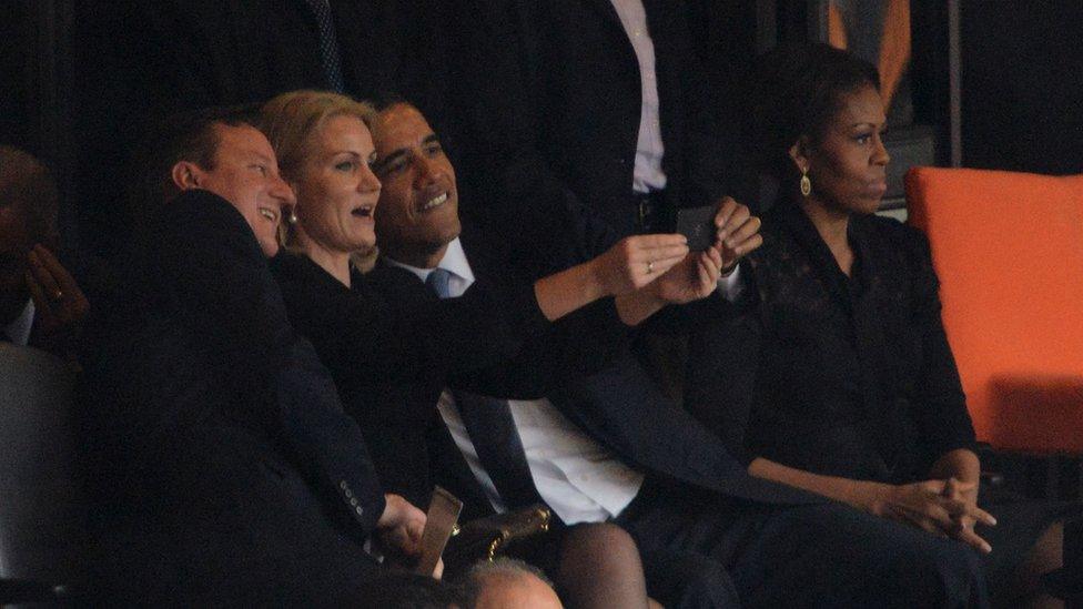 US President Barack Obama and British Prime Minister David Cameron pose for a picture with Denmark's Prime Minister Helle Thorning Schmidt at a memorial service for Nelson Mandela in December 2013