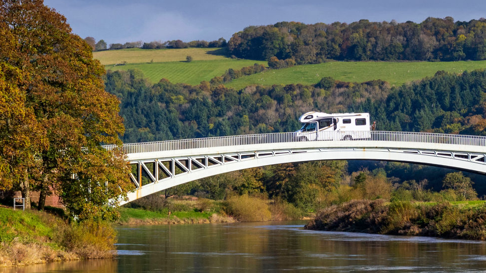 A motorhome crossing the river between England and Wales