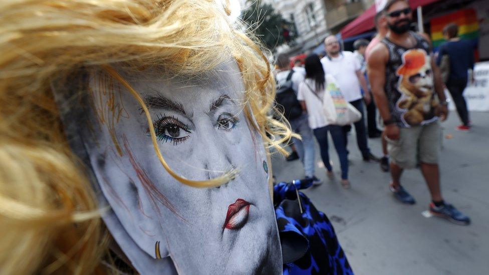 Cardboard face of US President Donald Trump with make up